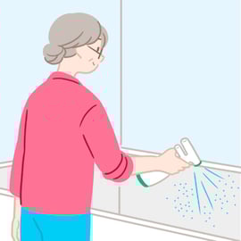 蓄圧スプレータイプの洗剤を浴槽に向けて使用している様子のイラスト